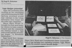 Town officials examine proposed logos