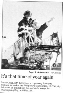 Santa arrives via firetruck!